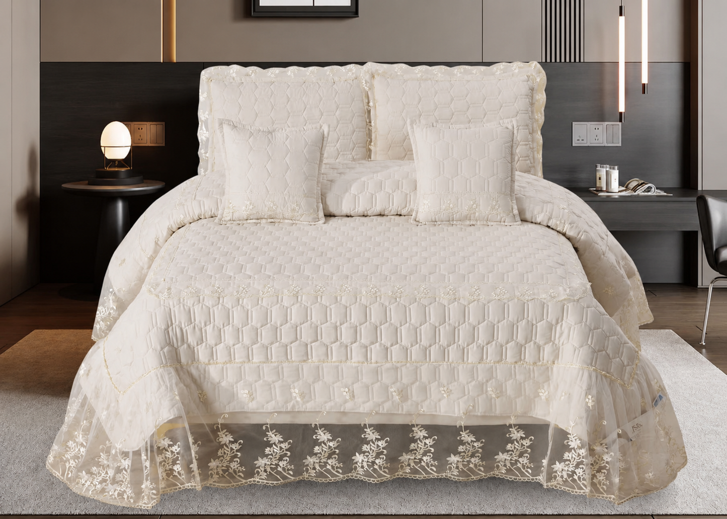 Quilted bedspread with lace trim on a bed in a bedroom setting